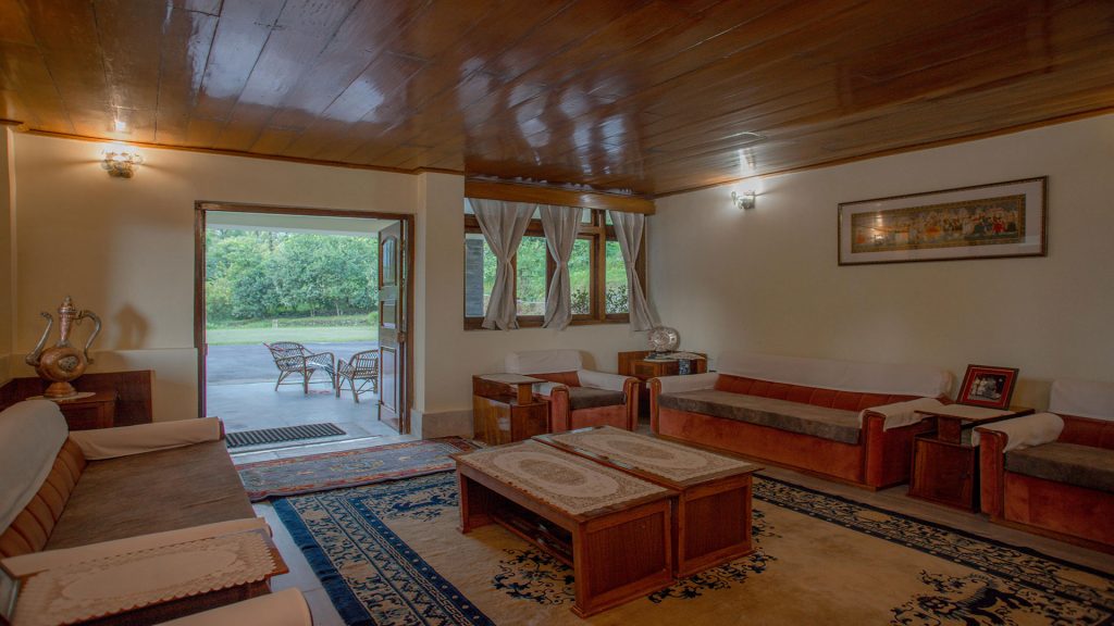 Spacious living room with unique furniture, lawn facing