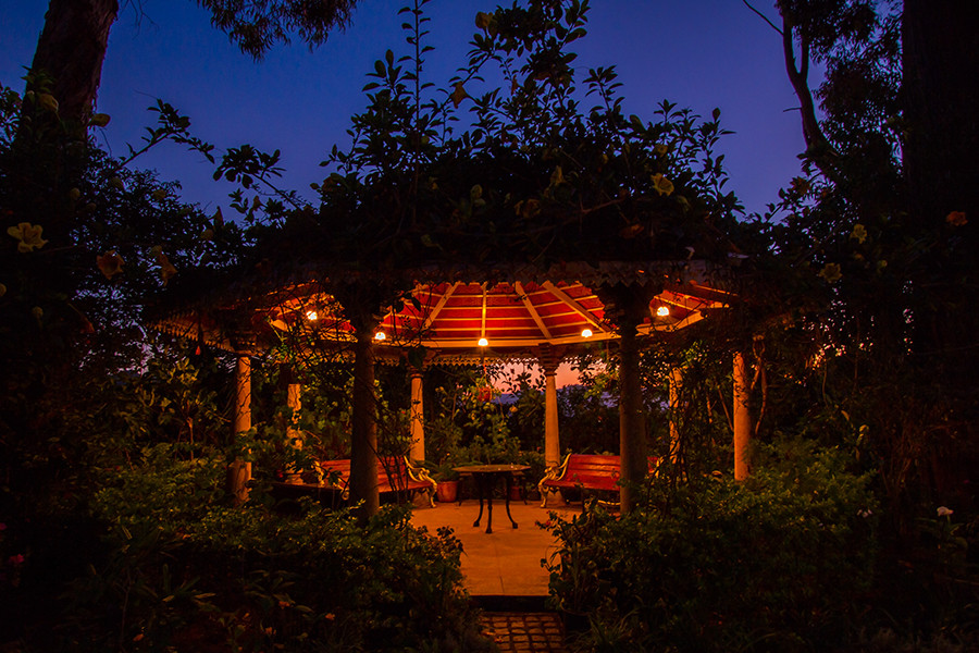 Lush green gazebo, dimly lit perfect for Christmas in villa
