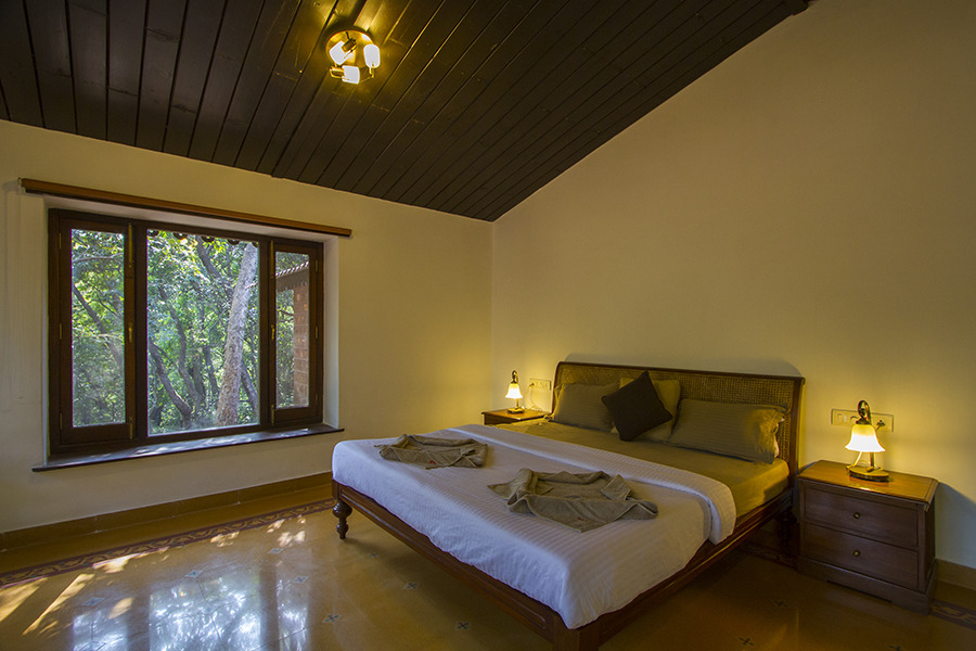 Cozy bedroom with wooden roof