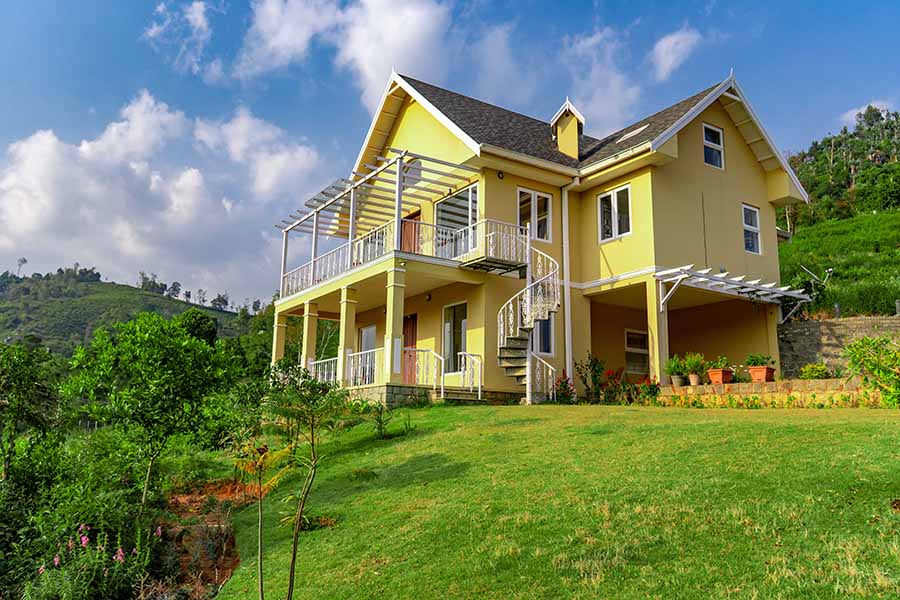 Yellow facade of villa in Coonoor