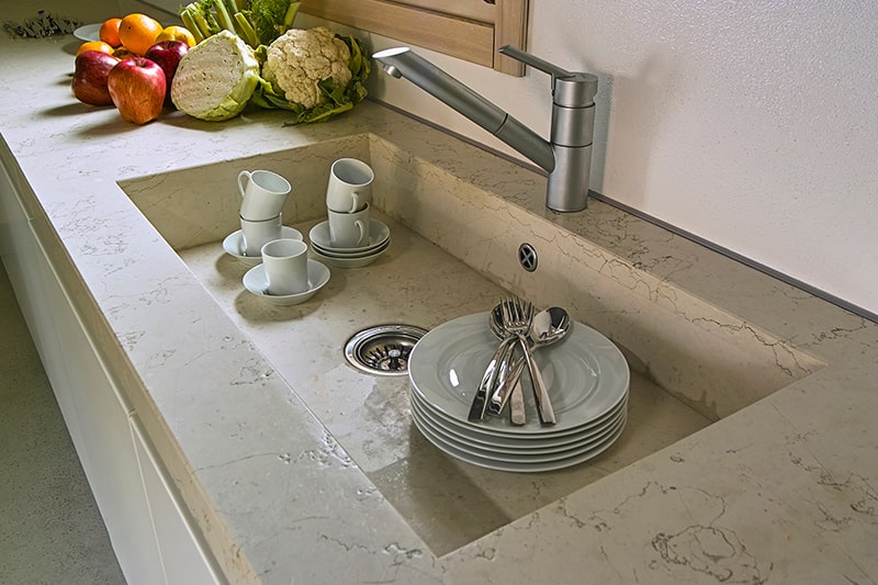 Integrated kitchen sink design made of marble, same as the countertop