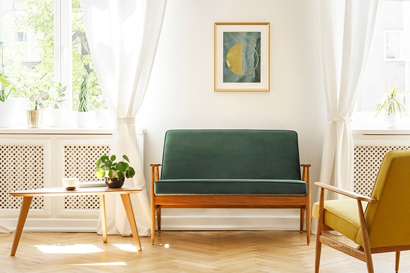 Wooden sofa design for living room with a green and yellow mid-century sofa