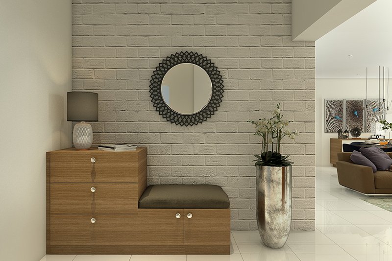 Entrance door decoration where a tall metal planter for modern foyer design
