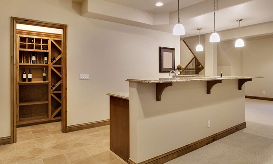 Tall home bar cabinet enclosed within a pantry with lots of space to store all your wine whisky rum and more.