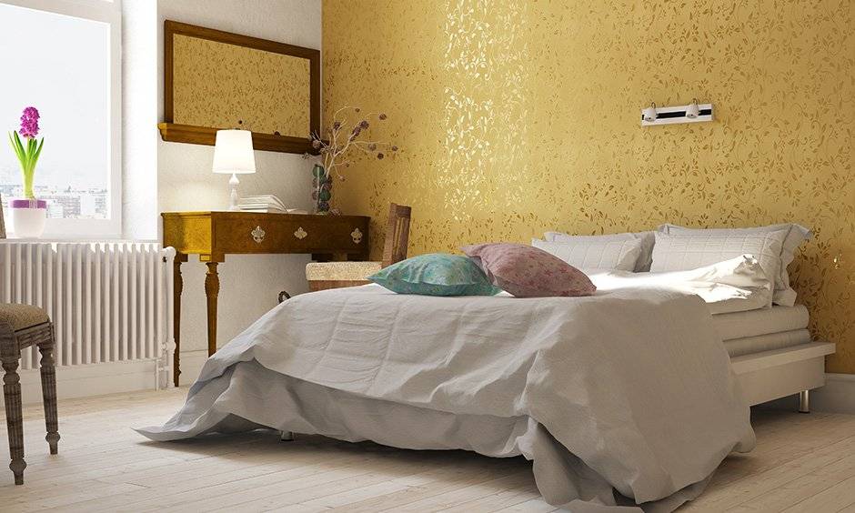 This gold wallpaper designs single handedly brightens up the interior designs of this bedroom and infuses glamour and charm