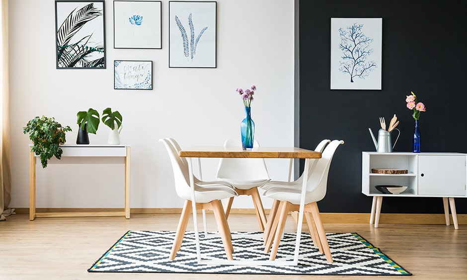 Decor for small dining room with a stylish rug and a minimal vase with fresh flowers