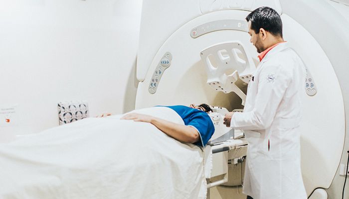 Doctor performing CT scan on patient