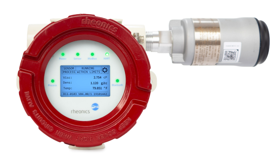 Rheonics SME-TRD sensor transmitter with WirelessHART adapter and integrated digital display showing viscosity, density, and temperature readings.