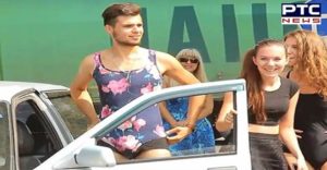 Woman And Men colorful bikini wearing pumps take Petrol free In Russia